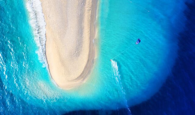 The tip of Zlatni rat with a windsurfer